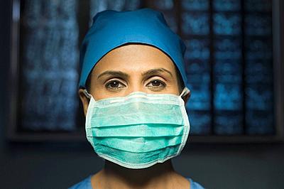 Portrait of a female surgeon wearing a surgical mask, Gurgaon, Haryana, India-stock-photo